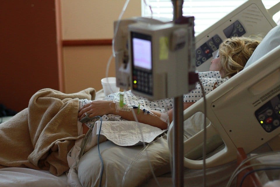 With vs. From: Interpreting COVID Hospitalization Rates
